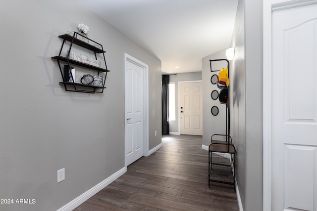 hallway with dark wood-type flooring