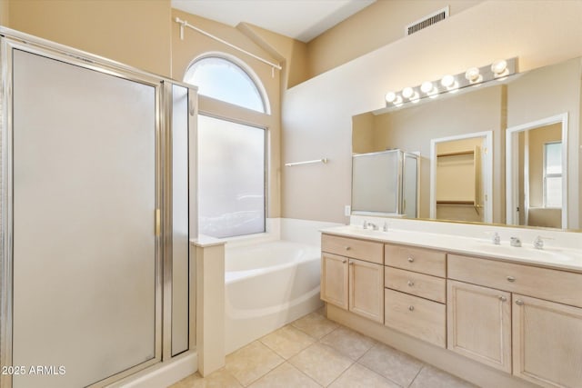 full bath with tile patterned floors, visible vents, a garden tub, a sink, and a shower stall