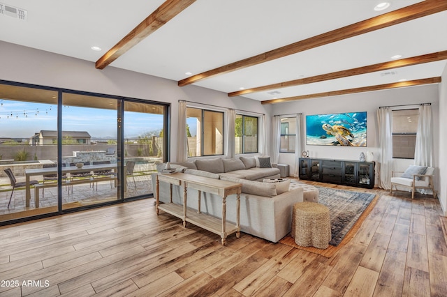 826 E Buist Ave, Phoenix, AZ 85042 - living room with beamed ceiling and light wood finished floors