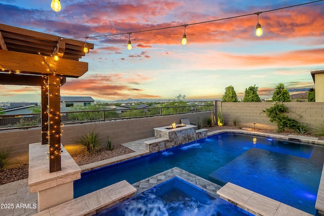 826 E Buist Ave, Phoenix, AZ 85042 - pool at dusk featuring a fire pit, a fenced backyard, and a pool with connected hot tub
