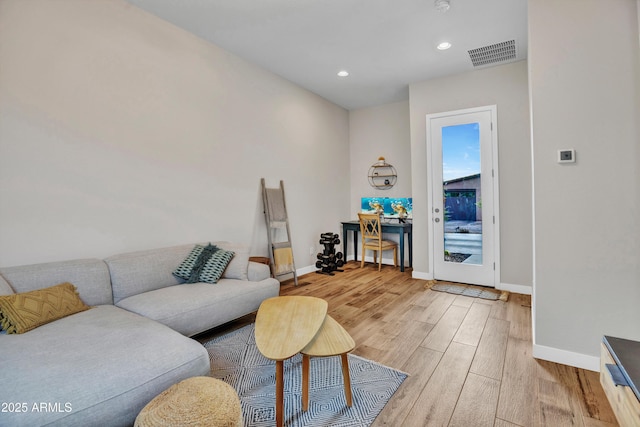 826 E Buist Ave, Phoenix, AZ 85042 - living area with light wood-style flooring, baseboards, and recessed lighting
