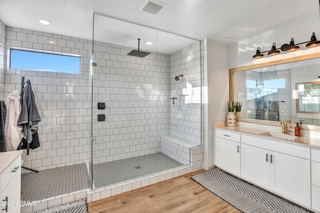 826 E Buist Ave, Phoenix, AZ 85042 - full bath with wood finished floors, a tile shower, vanity, and recessed lighting