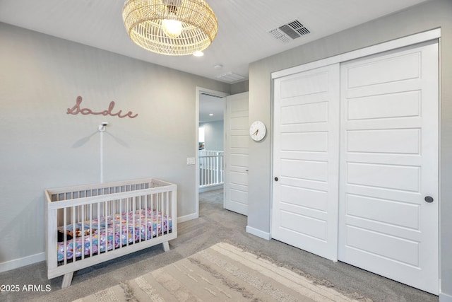 826 E Buist Ave, Phoenix, AZ 85042 - bedroom featuring a chandelier, baseboards, carpet floors, and recessed lighting