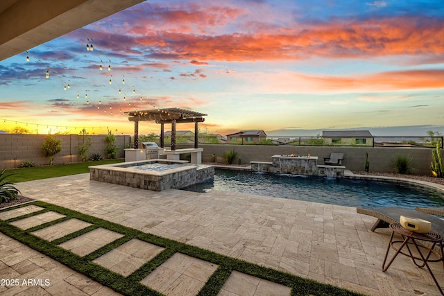 826 E Buist Ave, Phoenix, AZ 85042 - patio terrace at dusk featuring an in-ground hot tub and a fenced backyard