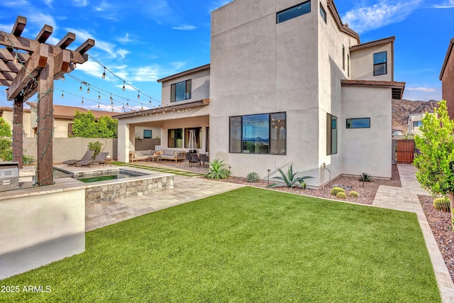 826 E Buist Ave, Phoenix, AZ 85042 - rear view of house featuring an outdoor living space, stucco siding, and a patio area