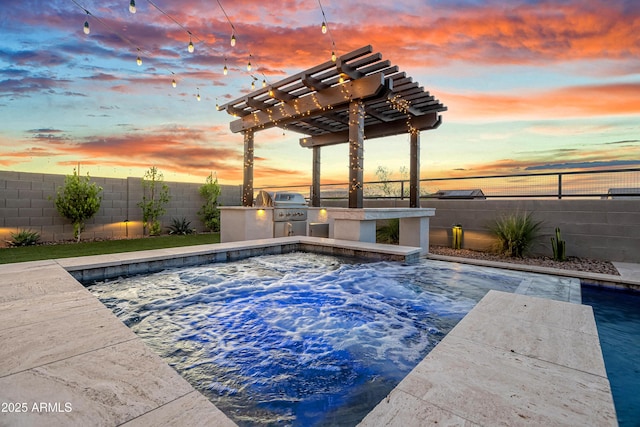 826 E Buist Ave, Phoenix, AZ 85042 - pool at dusk with an outdoor kitchen, an outdoor hot tub, a fenced backyard, a grill, and a pergola