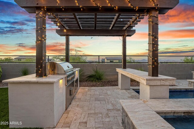 826 E Buist Ave, Phoenix, AZ 85042 - view of patio featuring an outdoor kitchen, a pergola, and a fenced backyard