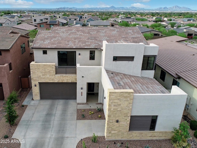 826 E Buist Ave, Phoenix, AZ 85042 - modern home featuring a residential view, a balcony, stucco siding, and concrete driveway
