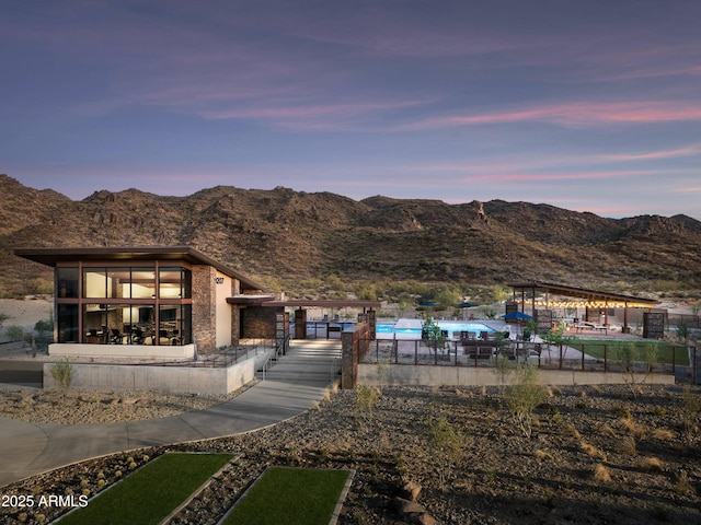 826 E Buist Ave, Phoenix, AZ 85042 - view of community with a mountain view, a pool, and fence