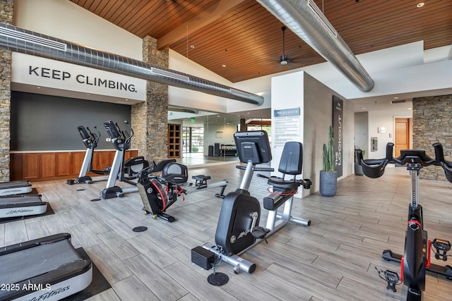 826 E Buist Ave, Phoenix, AZ 85042 - gym with beam ceiling, wood finished floors, wooden ceiling, high vaulted ceiling, and wainscoting