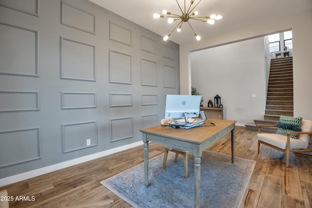 826 E Buist Ave, Phoenix, AZ 85042 - office with a chandelier, light wood finished floors, and baseboards
