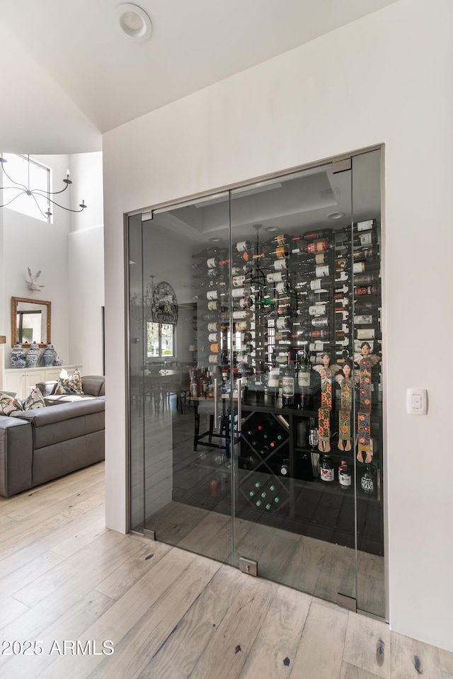 3511 N 39th Pl, Phoenix, AZ 85018 - wine cellar featuring wood finished floors and a chandelier