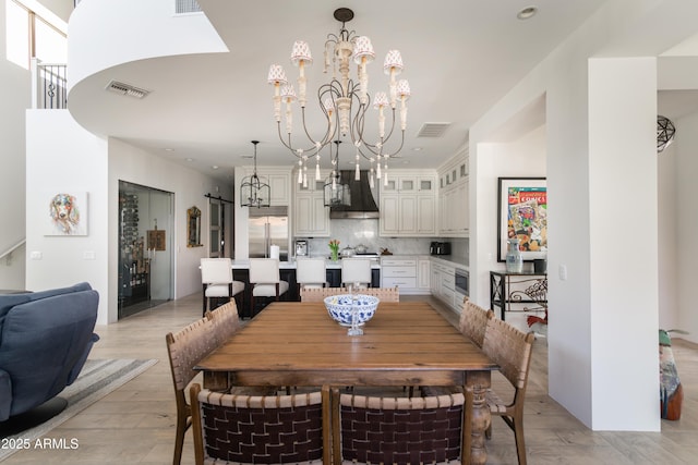 3511 N 39th Pl, Phoenix, AZ 85018 - dining area featuring a chandelier, light wood-style floors, and recessed lighting