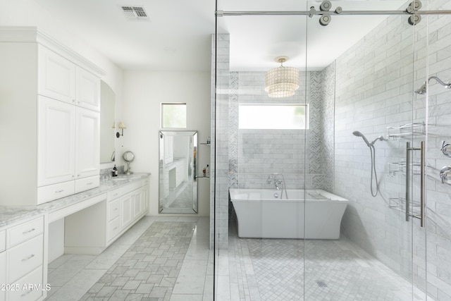 3511 N 39th Pl, Phoenix, AZ 85018 - bathroom featuring vanity, a freestanding tub, a stall shower, and a chandelier