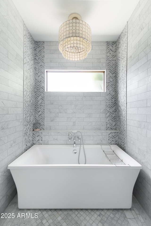 3511 N 39th Pl, Phoenix, AZ 85018 - bathroom with healthy amount of natural light, a freestanding bath, and tile patterned floors