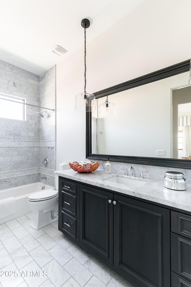 3511 N 39th Pl, Phoenix, AZ 85018 - bathroom with vanity, toilet, and shower / bathtub combination