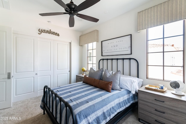 3511 N 39th Pl, Phoenix, AZ 85018 - bedroom with dark carpet, a closet, and ceiling fan
