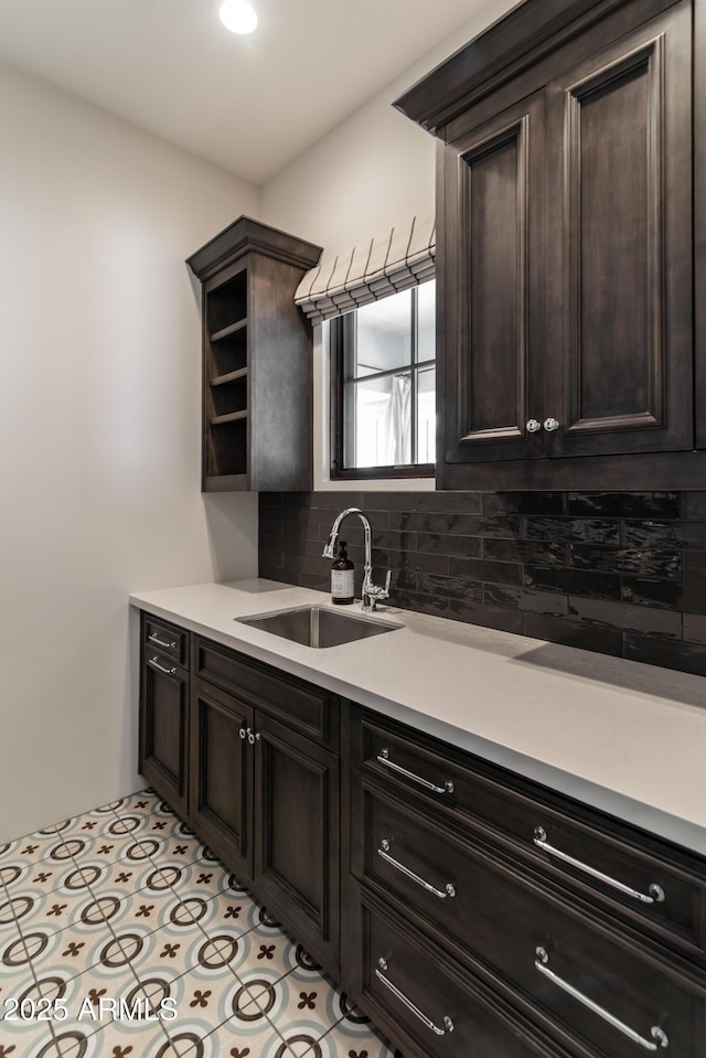 3511 N 39th Pl, Phoenix, AZ 85018 - kitchen with a sink, light countertops, tasteful backsplash, and dark brown cabinetry