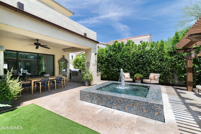 3511 N 39th Pl, Phoenix, AZ 85018 - view of patio / terrace featuring a ceiling fan, an outdoor kitchen, and outdoor dining area