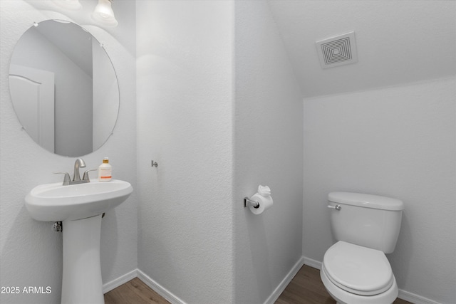 470 N 168th Ln, Goodyear, AZ 85338 - half bath with toilet, wood finished floors, visible vents, and baseboards