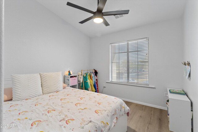 470 N 168th Ln, Goodyear, AZ 85338 - bedroom with visible vents, wood finished floors, baseboards, ceiling fan, and vaulted ceiling