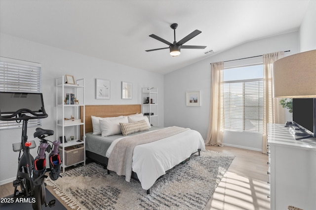 470 N 168th Ln, Goodyear, AZ 85338 - bedroom with ceiling fan, visible vents, lofted ceiling, and light wood-style flooring