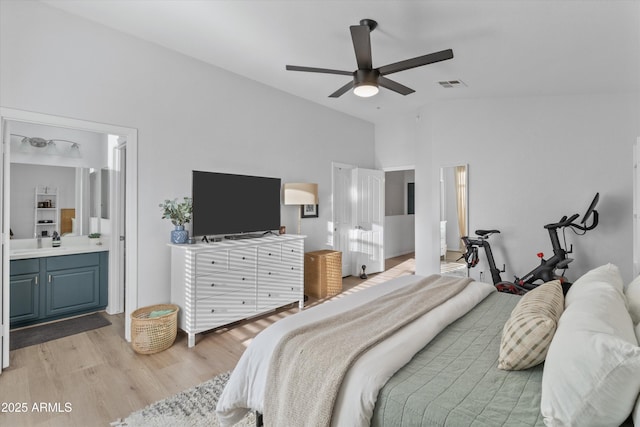 470 N 168th Ln, Goodyear, AZ 85338 - bedroom featuring light wood finished floors, visible vents, connected bathroom, high vaulted ceiling, and a ceiling fan