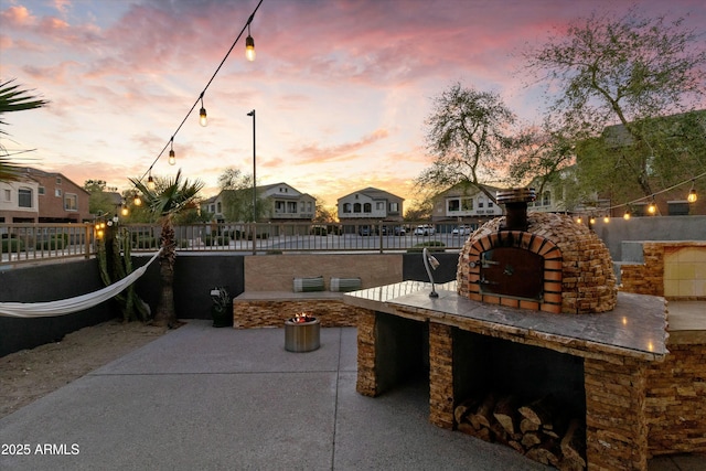 470 N 168th Ln, Goodyear, AZ 85338 - view of patio / terrace featuring area for grilling, fence, and a residential view