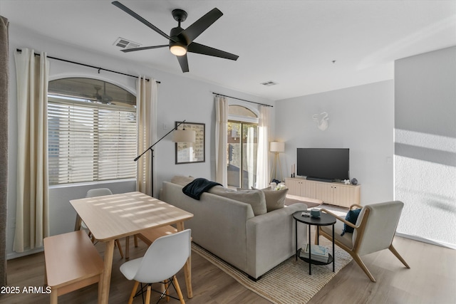 470 N 168th Ln, Goodyear, AZ 85338 - living room featuring visible vents, ceiling fan, and wood finished floors