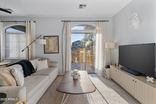 470 N 168th Ln, Goodyear, AZ 85338 - living room featuring visible vents and light carpet
