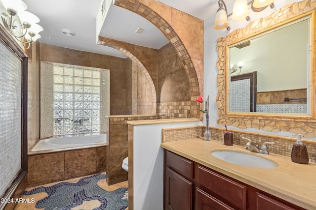 full bathroom featuring toilet, tasteful backsplash, a relaxing tiled tub, and vanity