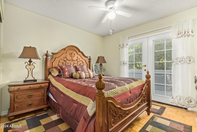 bedroom with access to exterior, a ceiling fan, a textured ceiling, and french doors