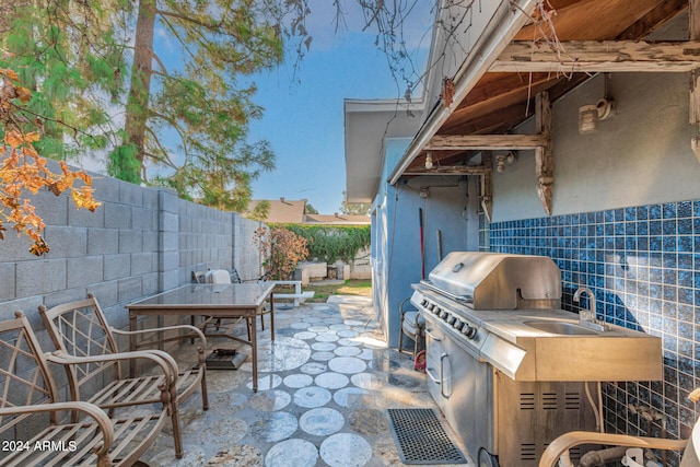 view of patio with a fenced backyard, area for grilling, and outdoor dining space