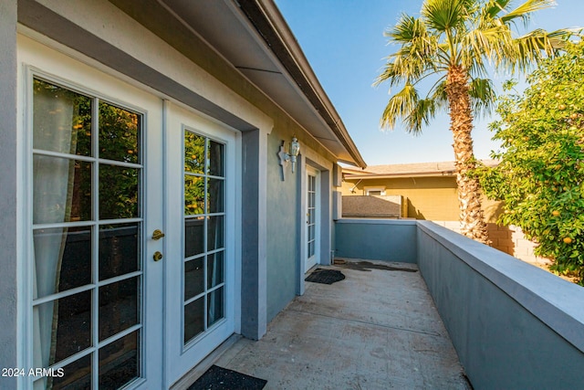 view of property exterior featuring a balcony and stucco siding