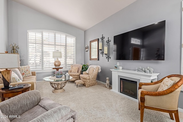 carpeted living room with lofted ceiling