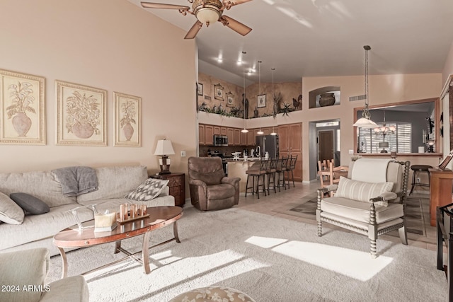 living room featuring ceiling fan, light colored carpet, and high vaulted ceiling