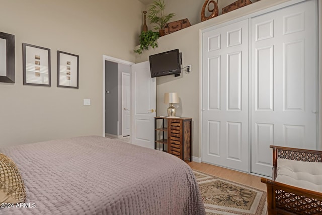 bedroom featuring hardwood / wood-style flooring and a closet