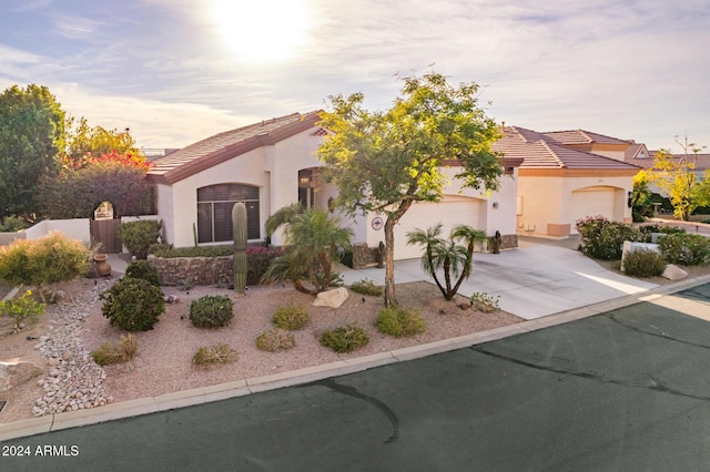 mediterranean / spanish-style house featuring a garage