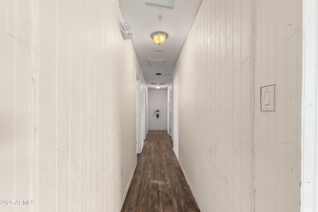 corridor featuring dark wood-style floors