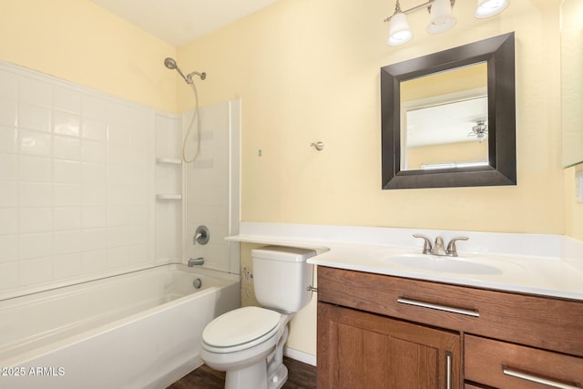 bathroom featuring vanity, toilet, and shower / bathtub combination