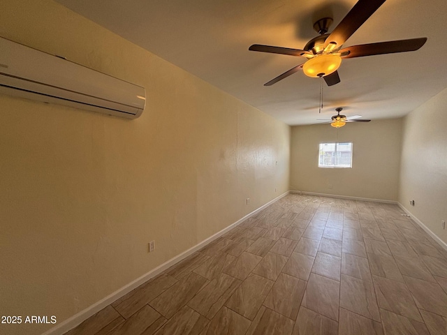 spare room featuring an AC wall unit and baseboards