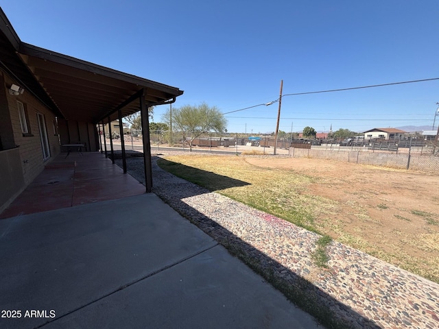 view of yard with a patio and fence