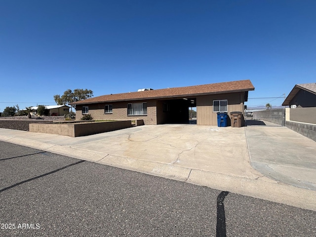 ranch-style home with fence