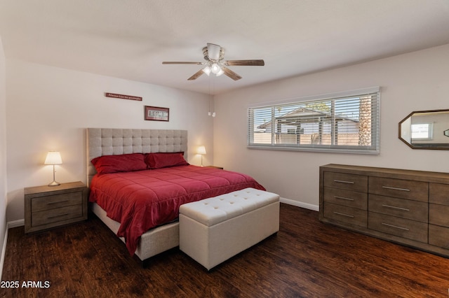 bedroom featuring wood finished floors, baseboards, and a ceiling fan
