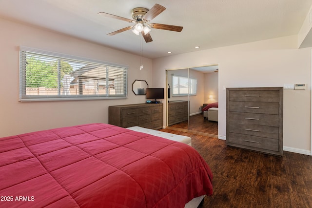 bedroom featuring wood finished floors, a closet, baseboards, a ceiling fan, and recessed lighting