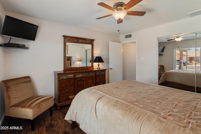 bedroom featuring dark wood-style flooring and a ceiling fan