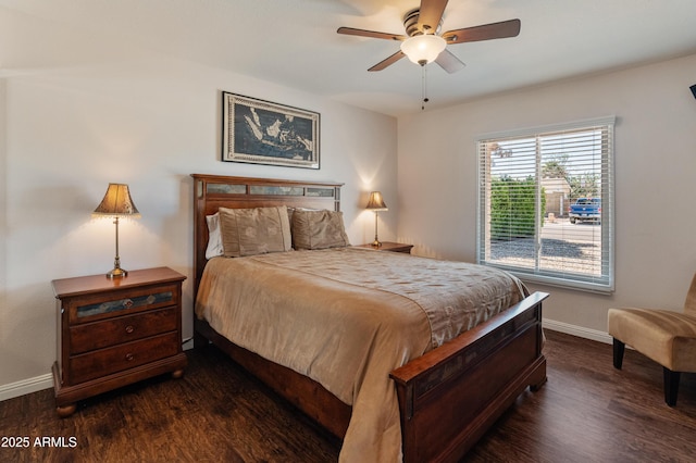 bedroom with baseboards, dark wood finished floors, and ceiling fan