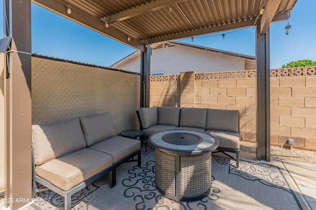 view of patio / terrace featuring an outdoor hangout area and fence