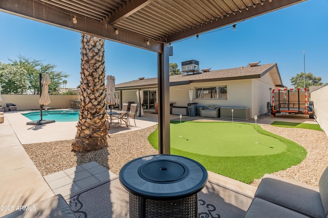 view of patio / terrace featuring an area to practice putting, a fenced backyard, and central air condition unit
