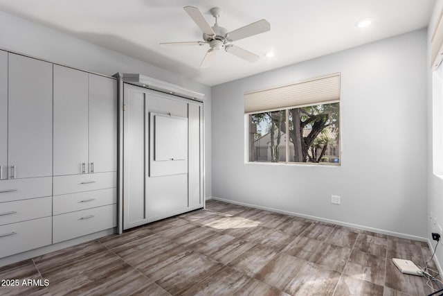 unfurnished bedroom featuring baseboards, a ceiling fan, and recessed lighting